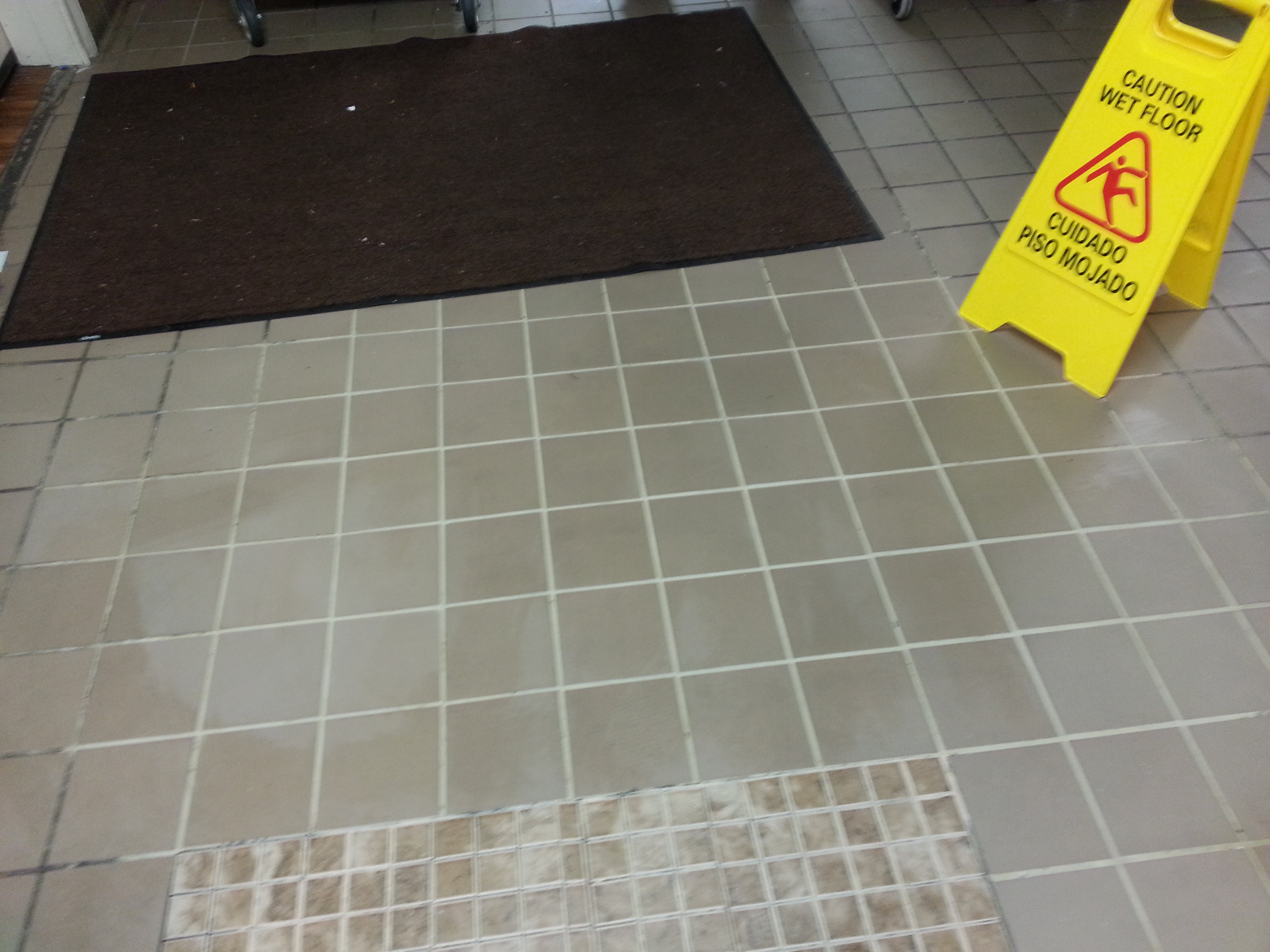 clean grout lines surrounded by dirty grout lines